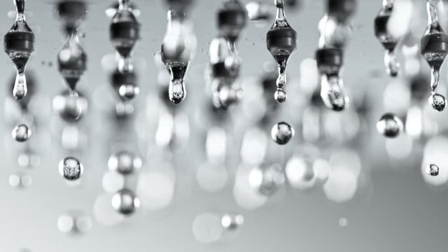 Super Slow Motion Shot of Water Droplets Falling From Shower Head at 1000fps.