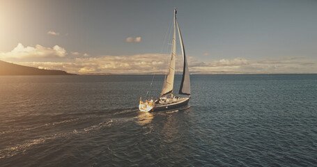Aerial yacht regatta race at open sea. White sail boat at summer sunlight day. Amazing seascape of...