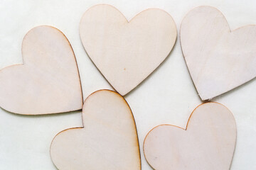 Obraz premium wooden hearts in a green nylon bag
