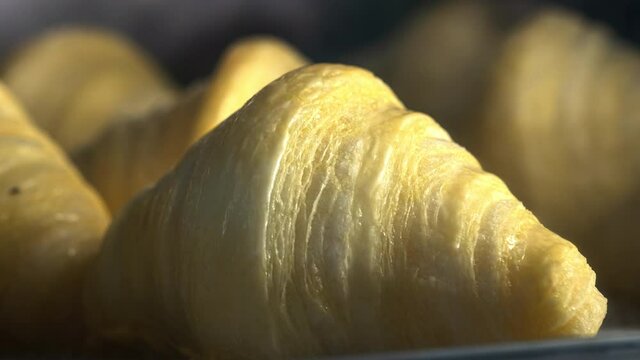 Timelapse homemade puff pastry croissants in the kitchen oven. Traditional European Viennese buns. Healthy breakfast. Hot crispy baked pies. Morning dessert. The baker bakes food. High-calorie dough