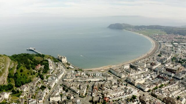 Aerial view of Llandudno in the distance from the top of great orme summit cable car station