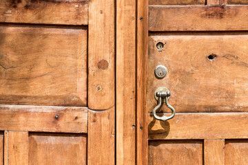 detail of colorful rustic door, with padlock