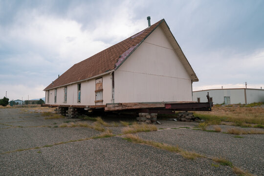 House on pallets and blocks, about to be moved in the abandoned ghost town of Jeffrey City Wyoming