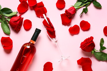 Beautiful roses, bottle of wine and glass on color background