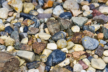 Rocks sea beach or stones background, Many small stones in assorted colors, Abstract rough wallpaper nature concept