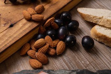 star anise meat table sausage almonds and grapes cheese