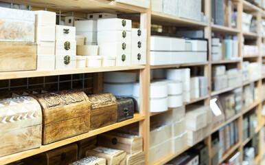 Obraz na płótnie Canvas Supermarket of household goods - wooden original caskets on shelves store