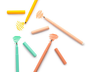 Felt tip pens and strokes on white background