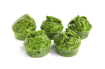 Tasty spinach muffins on white background
