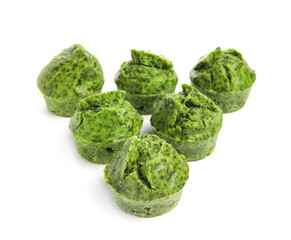 Tasty spinach muffins on white background