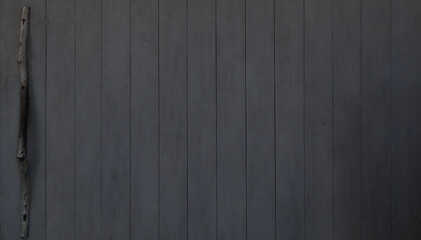 Detail of antique wooden board door. Background of a sliding or opening door made of wood boards.