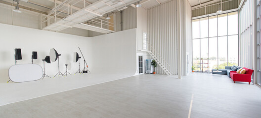 Empty wide and tall indoor industrial design photography studio workshop room full of space and...