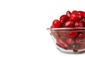 Glass bowl with fresh dogwood berries on white background, closeup