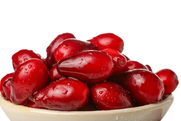 Bowl with fresh dogwood berries on white background, closeup