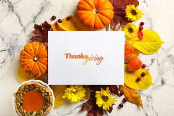 Autumn composition with pumpkins, pie and text THANKSGIVING on light background