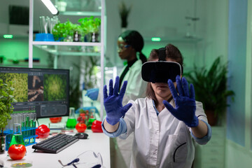 Portrait of biologist researcher woman analyzing virtual gmo plants expertise using vr headphones...