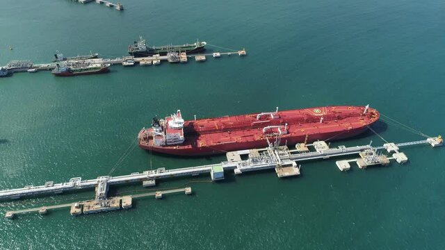Aerial shot of oil tanker ships anchored at the oil terminal.