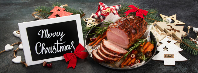 Naklejka na ściany i meble Christmas composition with baked ham.