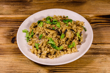 Risotto with mushrooms and paesley in a plate