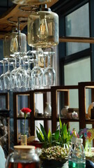 The interior bar view with the decoration and glass cups around it