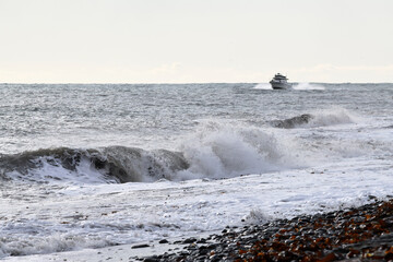 A fishing boat returns to the Homer, Alaska, harbor on Kachemak Bay.