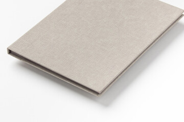 Grey hardcover book on white background