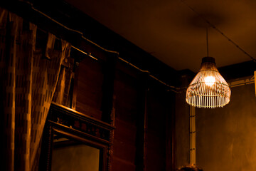 the wooden lamp hanging in a wooden house