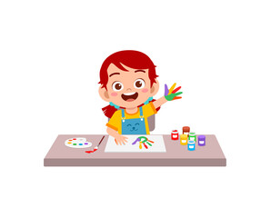 cute little girl using paint to hand for art
