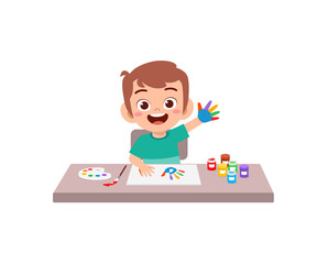 cute little boy using paint to hand for art