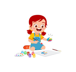 cute little boy using paint to hand for art