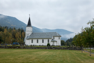 Fototapeta na wymiar Skjonne kirke - church - white wooden church in Nore, Norway