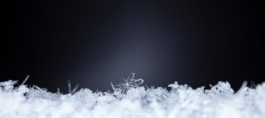 Snowflake. Macro photo of real snow crystal. Beautiful winter background seasonal nature and the...