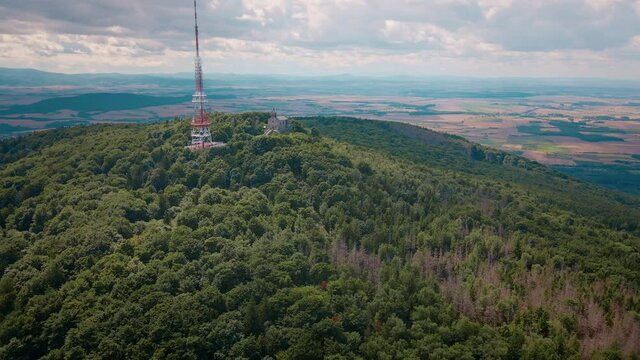Drone flight over mountain village with forests. Sleza mountain near Wroclaw in Poland. Nature background, aerial view