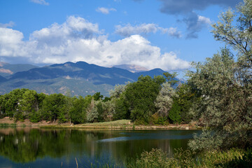 Fototapeta na wymiar Scenic Mountain Lake reflection scene with Evergreen Trees in Colorado Springs