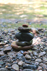 Pyramid of stones in the Japanese style on the river bank. Meditation. Relax. 