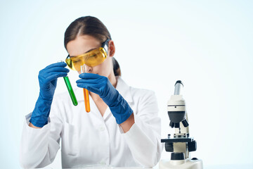 woman biologist laboratory research chemical solution microscope