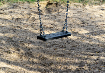 Plastic swing in kids playground