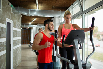 Personal trainer assisting woman to lose weight. Sport exercise people healthy lifestyle concept