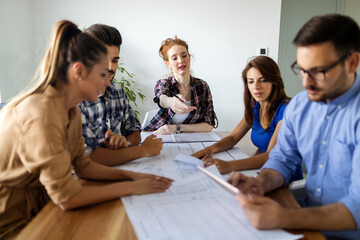 Happy multiethnic group of business people working together on meeting in office