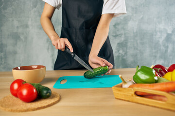 housewife on the kitchen cutting vegetables salad diet