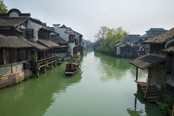 Fototapeta premium Waterfront houses in Wuzhen Xizha Scenic Area, Wuzhen is a 1300-year-old water town, a national 5A scenic area