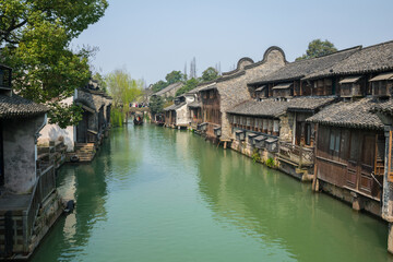 Fototapeta na wymiar Waterfront houses in Wuzhen Xizha Scenic Area, Wuzhen is a 1300-year-old water town, a national 5A scenic area