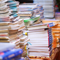 Stacks of old books in the library. Selective Focus