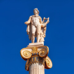 Obraz premium Apollo the ancient Greek god of poetry and music under blue sky with space for your text, Athens Greece