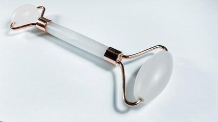 White massage quartz roller for the face close-up isolated on a white background