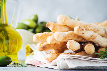 Italian grissini breadsticks with herbs and sesame seeds, selective focus