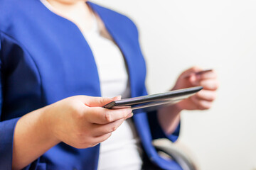 Business women with laptop and credit card with coin money on business office table