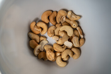 Fototapeta na wymiar Roasted cashew nut in a white bowl