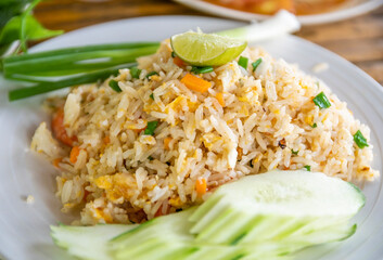 Fried rice with egg and vegetable on blurred