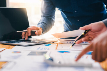 Business teamwork process, businessman advisor, two business people talking, planning analyze investment report and marketing on a laptop in the office, Market analysis